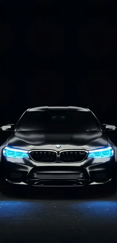 Sleek black car with blue headlights against a dark background.