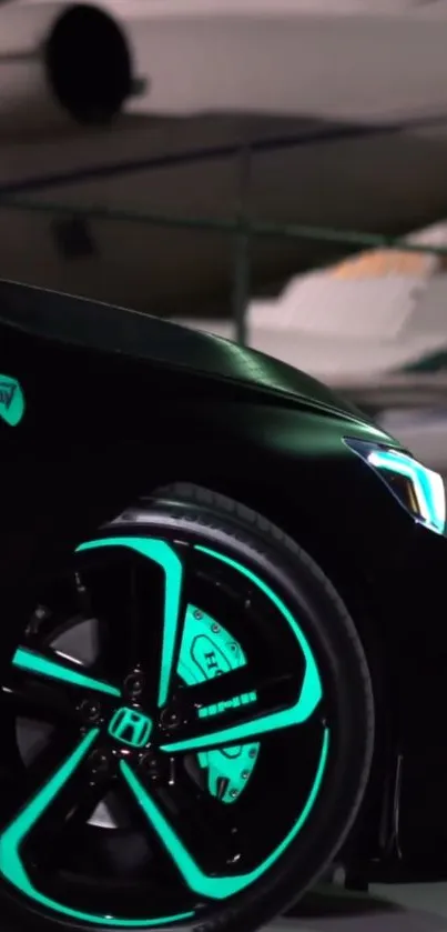 Sleek black car with vibrant neon teal wheel glow.