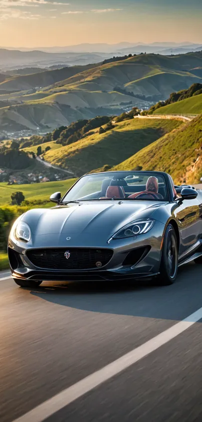 Convertible car speeding on scenic hillside road under sunset.