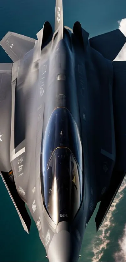 Sleek fighter jet flying over ocean with clouds.