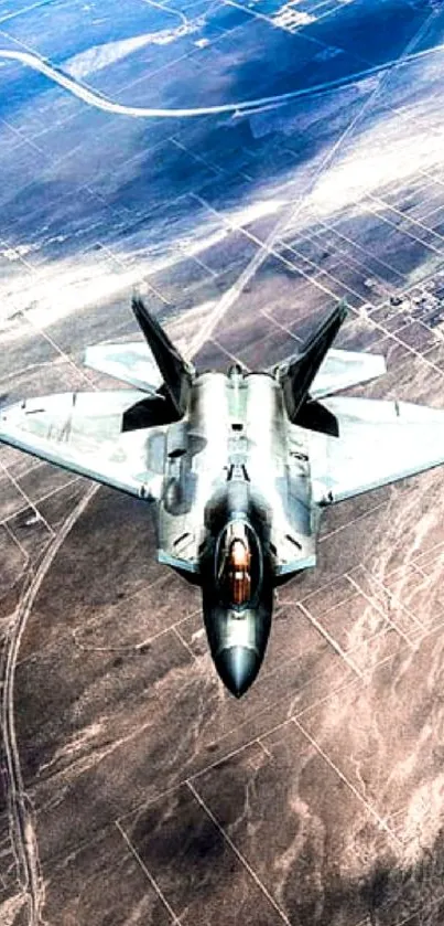 Sleek fighter jet soaring over a desert landscape.