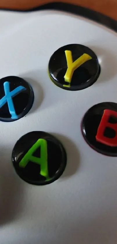 Close-up of a gaming controller with colorful buttons.