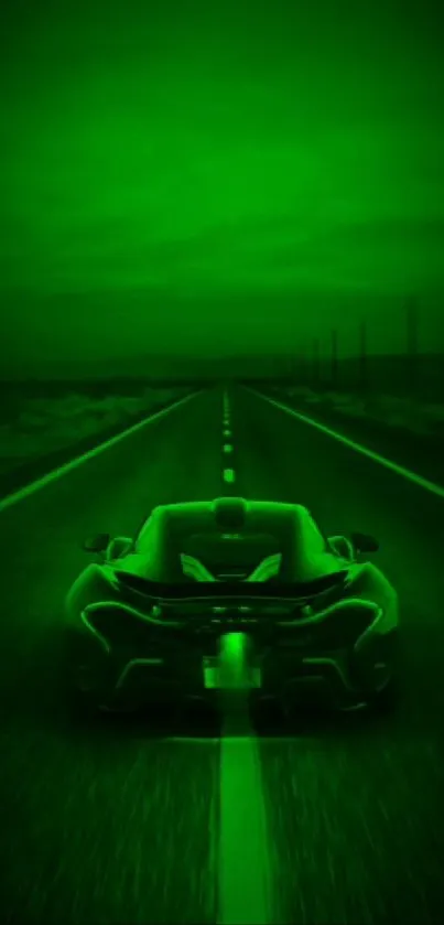 Sleek green car on a dark highway, road ahead.