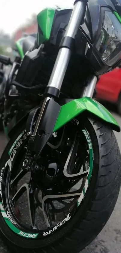 Sleek green motorcycle on urban road.