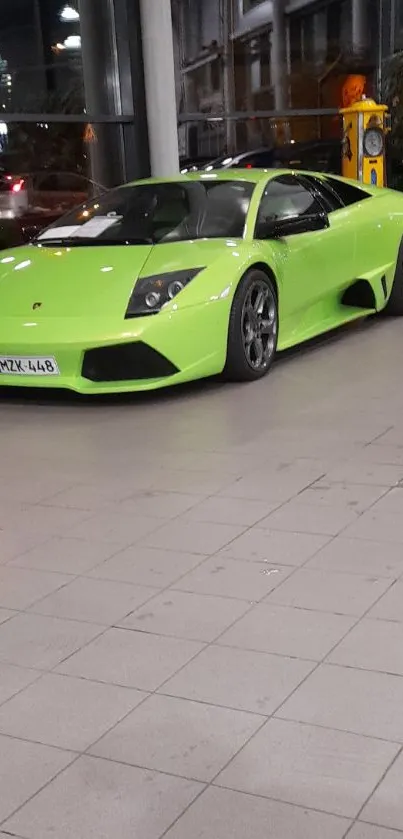 Sleek green sports car in modern showroom.