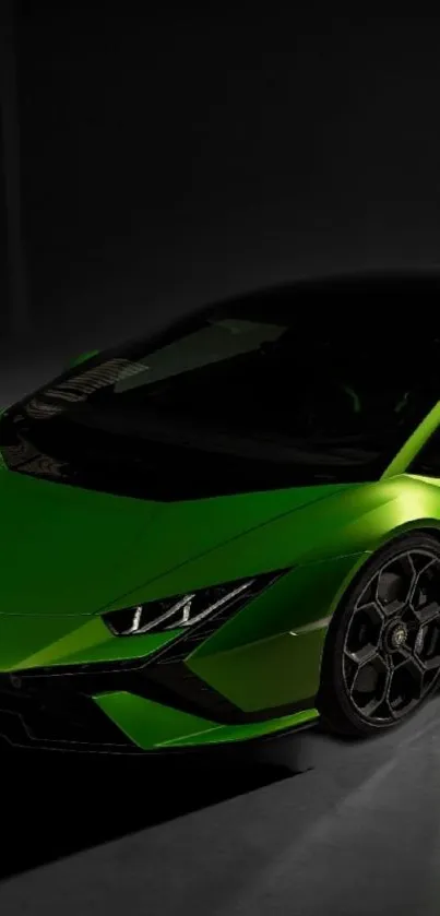 Sleek green sports car in dim light showcasing luxurious design.