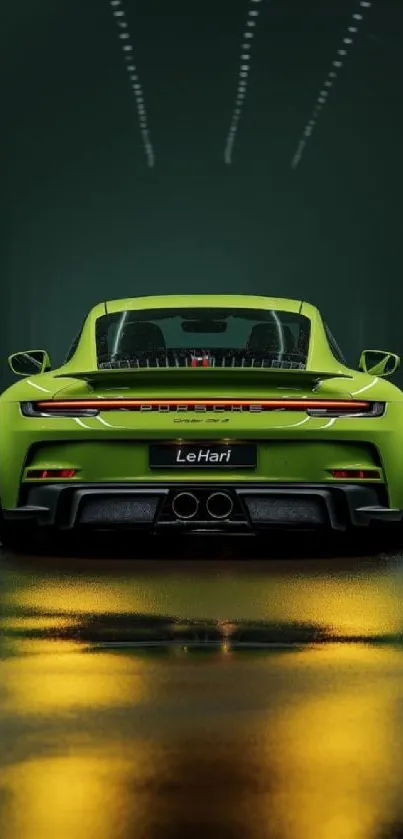 A sleek green sports car drives in an urban setting at night.