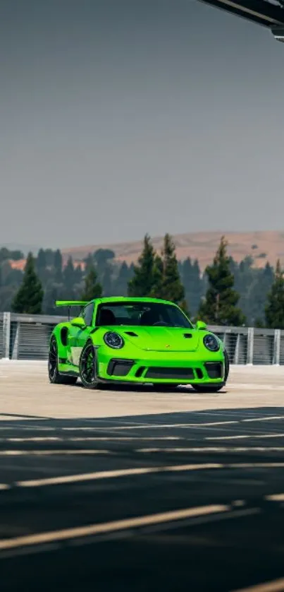 Vibrant green sports car on scenic backdrop.