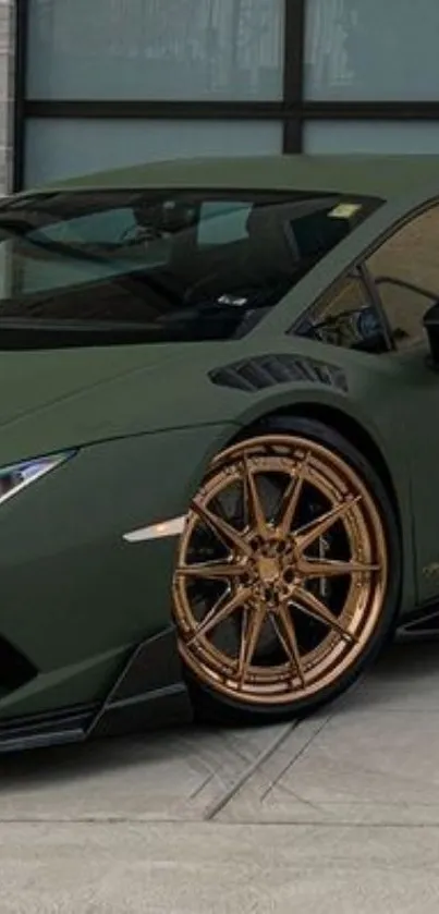 Green sports car with bronze wheels, features a matte finish.