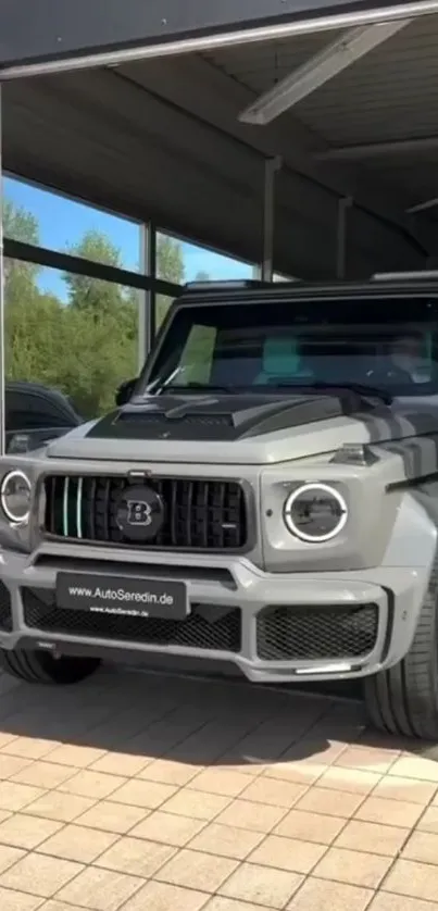 Sleek grey luxury SUV parked in a modern garage.