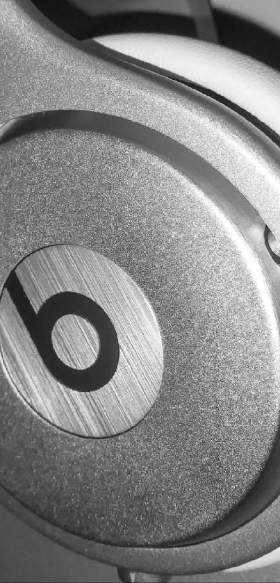 Close-up of sleek gray headphones in monochrome.
