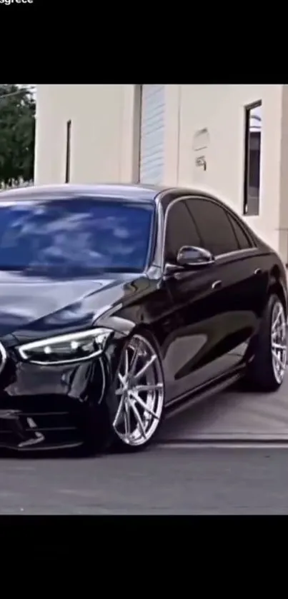 Luxury black sedan with shiny rims