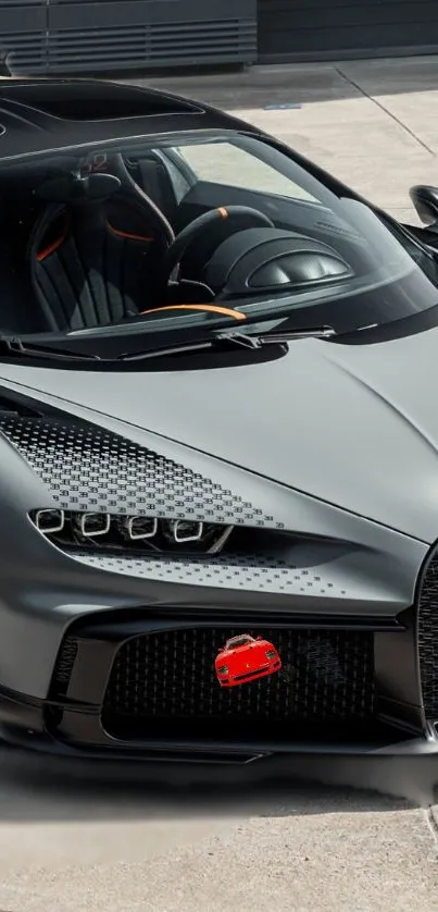 Sleek luxury sports car in gray tone wallpaper.