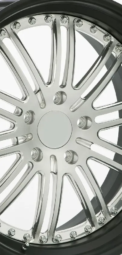 Sleek metallic car wheel with elegant design.