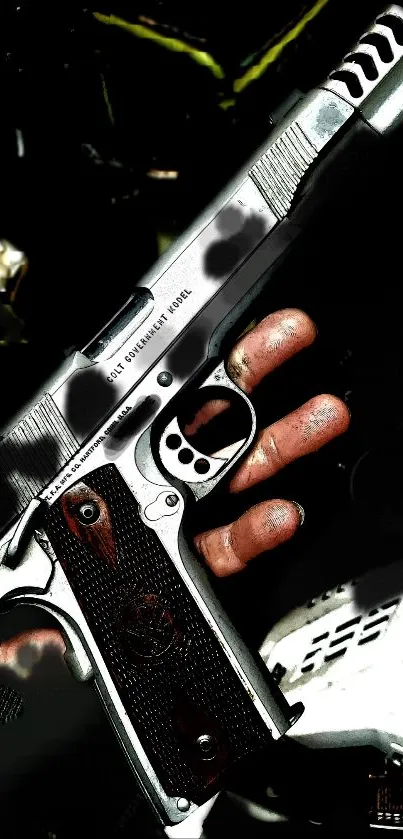 Black and metallic handgun held in hand with intricate details.