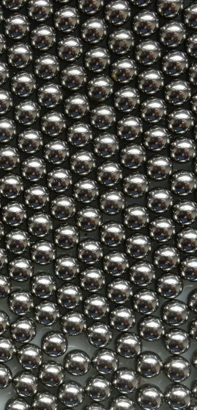 Glossy metallic spheres in a sleek design for mobile wallpaper.