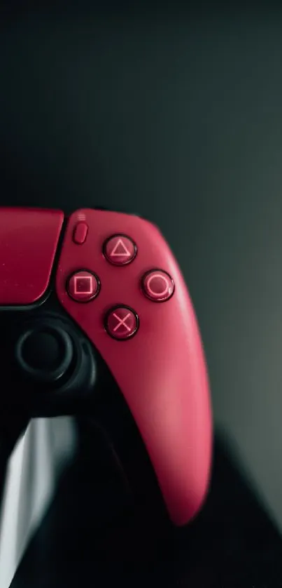 Stylish red game controller on dark background