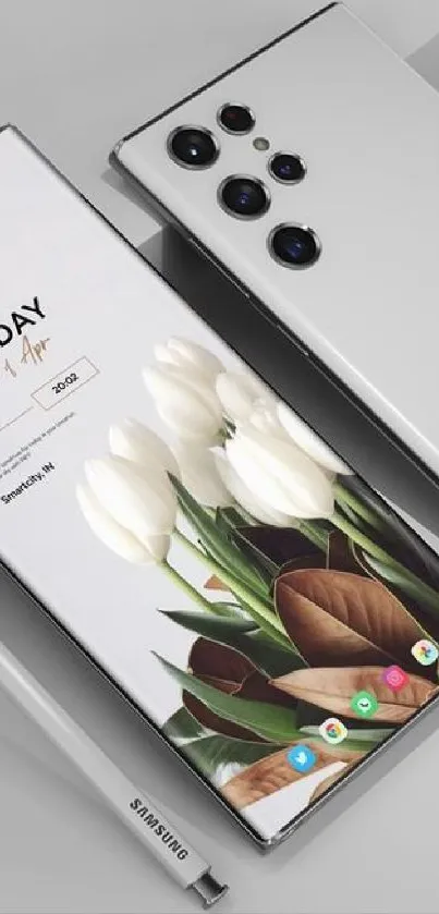 Sleek mobile phone with white floral wallpaper.