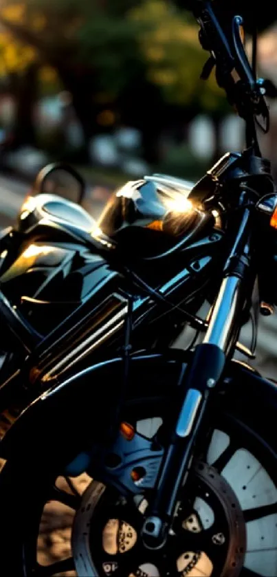 Black motorcycle standing on a street with reflective highlights.