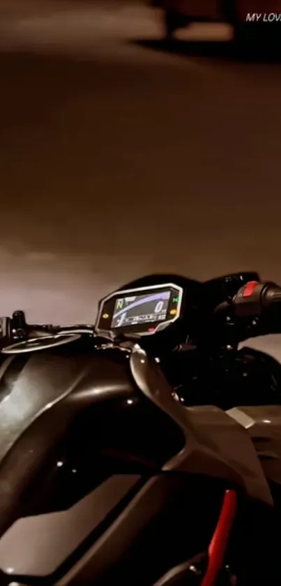 Close-up of a motorcycle dashboard at night.