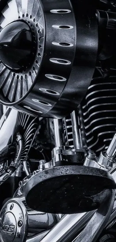 Close-up of sleek chrome motorcycle engine in black and white.