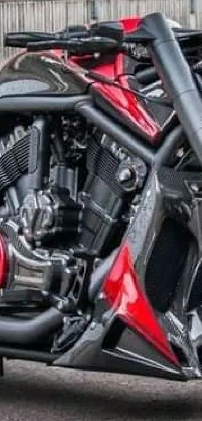 Close-up of a custom motorcycle with red and black accents, showcasing engine details.