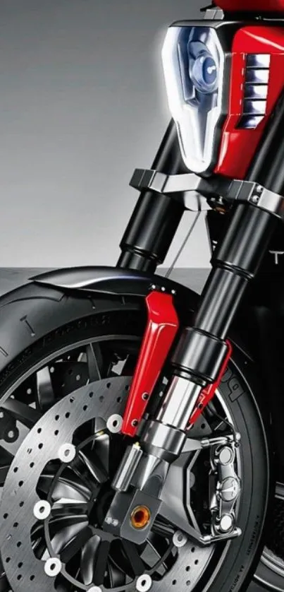 Close-up of a sleek red motorcycle front wheel interface.