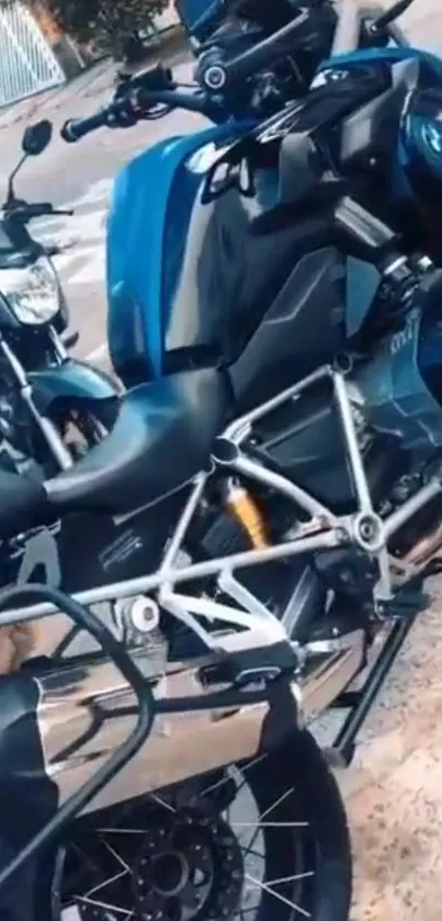 Sleek blue motorcycle parked outdoors, showcasing modern design.