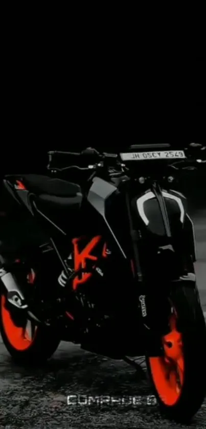 Motorcycle with black and orange design on a dark background.