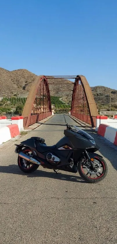 Motorcycle on a scenic bridge with hills in the background