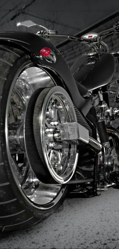 Close-up of a sleek motorcycle's rear wheel and chrome detailing.