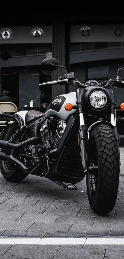 Classic motorcycle parked in urban street setting, dark theme.