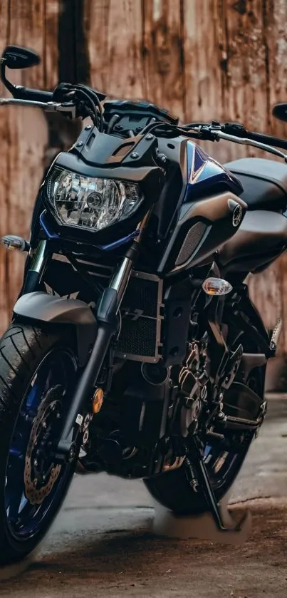 Sleek motorcycle with a brown wooden background.