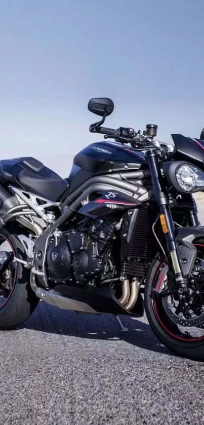 Sleek motorcycle on a clear road backdrop.