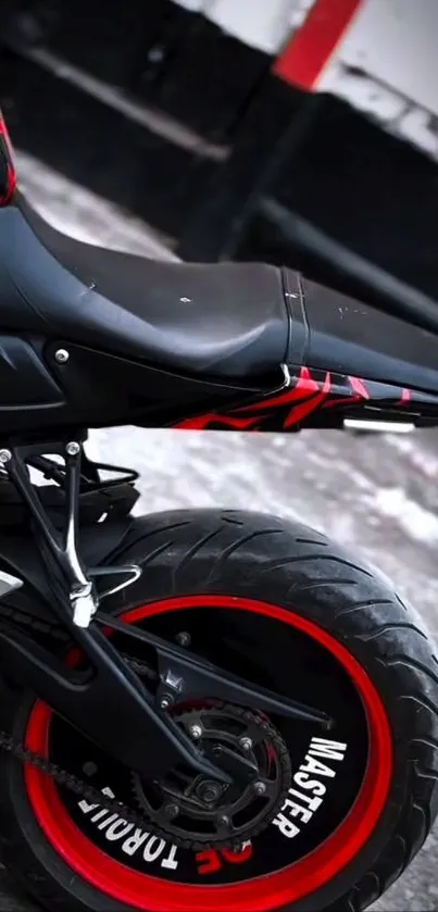 Close-up of a motorcycle tire with red accents.