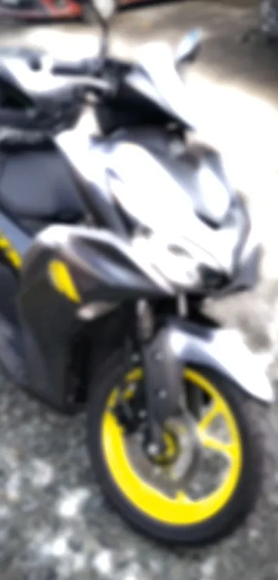 Motorcycle with yellow wheels blurred in sleek design.