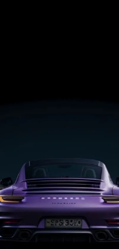 Purple sports car at night with urban backdrop.