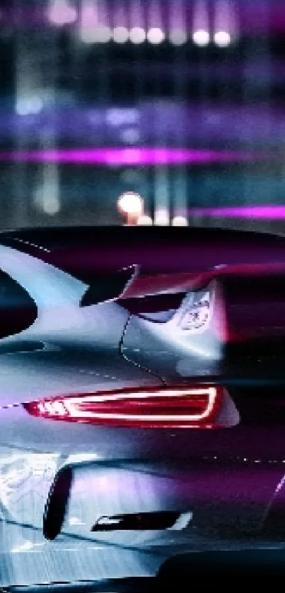 Sleek sports car at night in urban setting with neon lights.