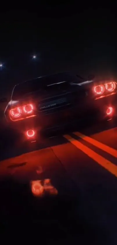 Sleek car with glowing headlights on a dark night road.