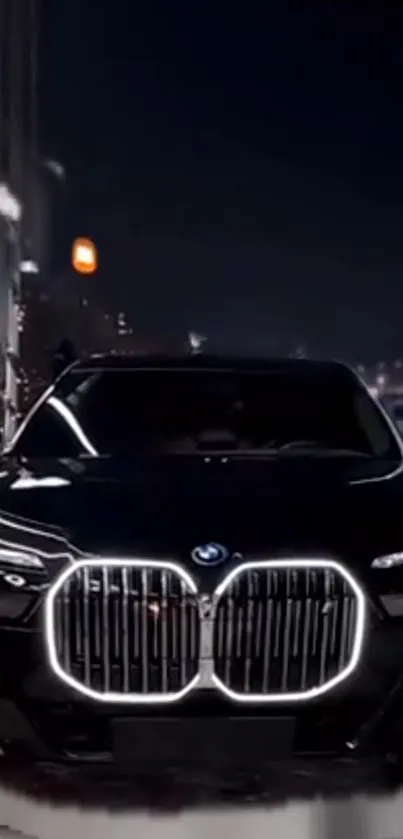 A sleek black car with illuminated lights in a modern city at night scene.