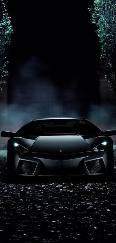 Sleek black supercar on a dark, misty road at night.