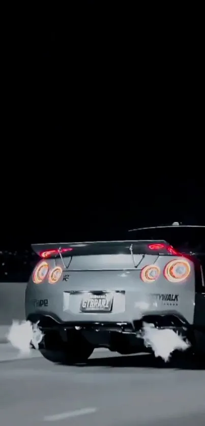 Nissan GT-R emitting flames during night drive.