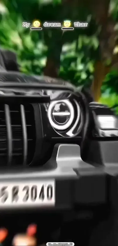 Sleek SUV with blurred green background.