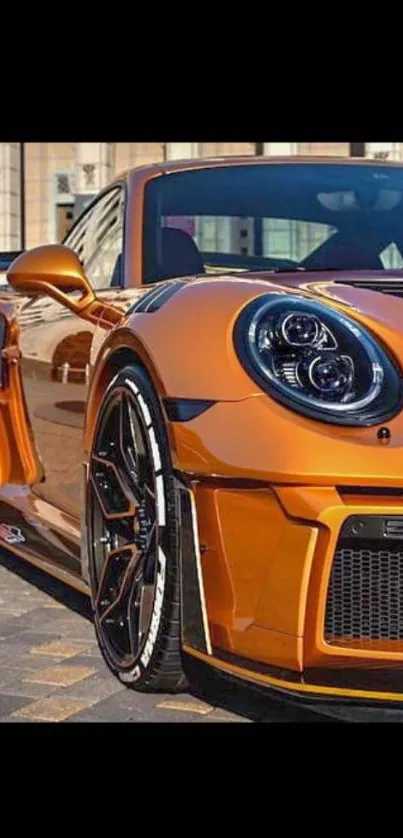 Orange sports car parked in urban scene, close-up view.