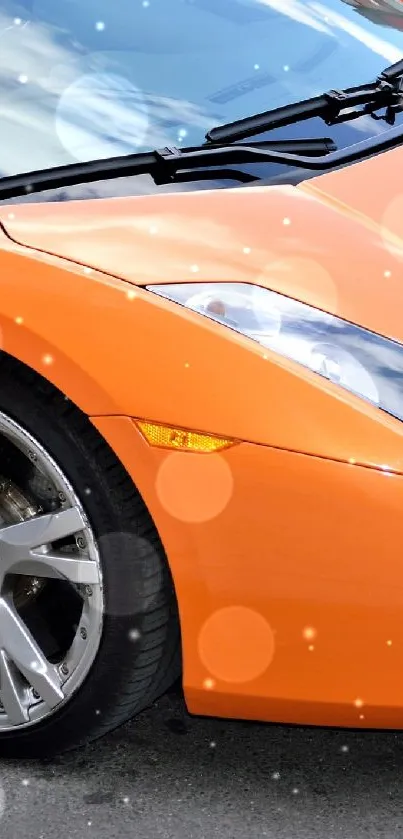 Orange sports car parked on street, sleek design.