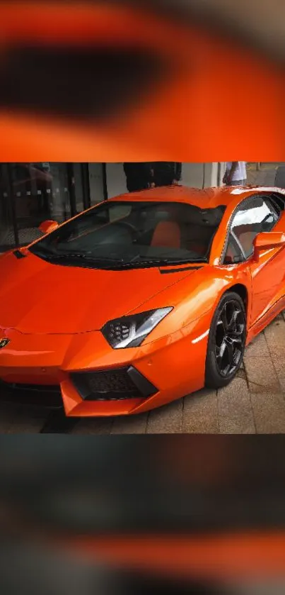 Vibrant orange sports car parked outdoors, showcasing sleek and luxurious design.