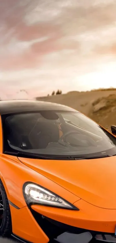 Orange sports car on an open road wallpaper.