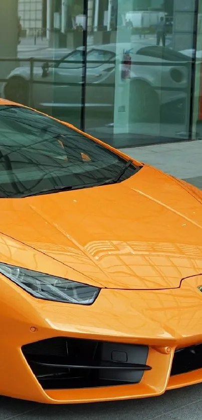 Orange sports car parked in urban setting.