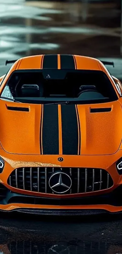 Orange sports car with black stripes parked indoors.