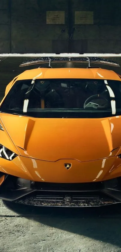 Dynamic orange supercar in an industrial setting captures speed and luxury.